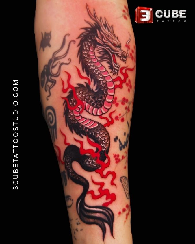 Black and red dragon tattoo crafted by one of the best tattoo artists in Kolkata at 3Cube Tattoo Studio.